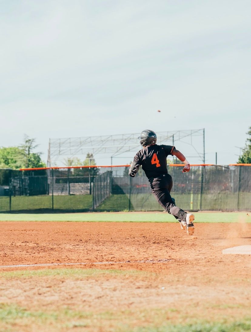 Kai Watts, #4, running the bases at full speed